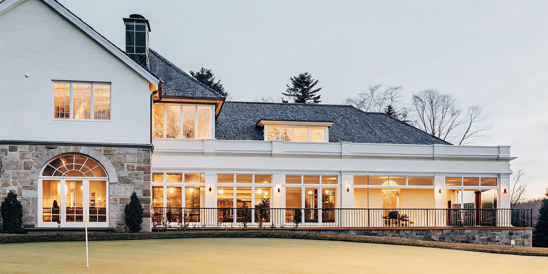 A private golf clubhouse at dusk